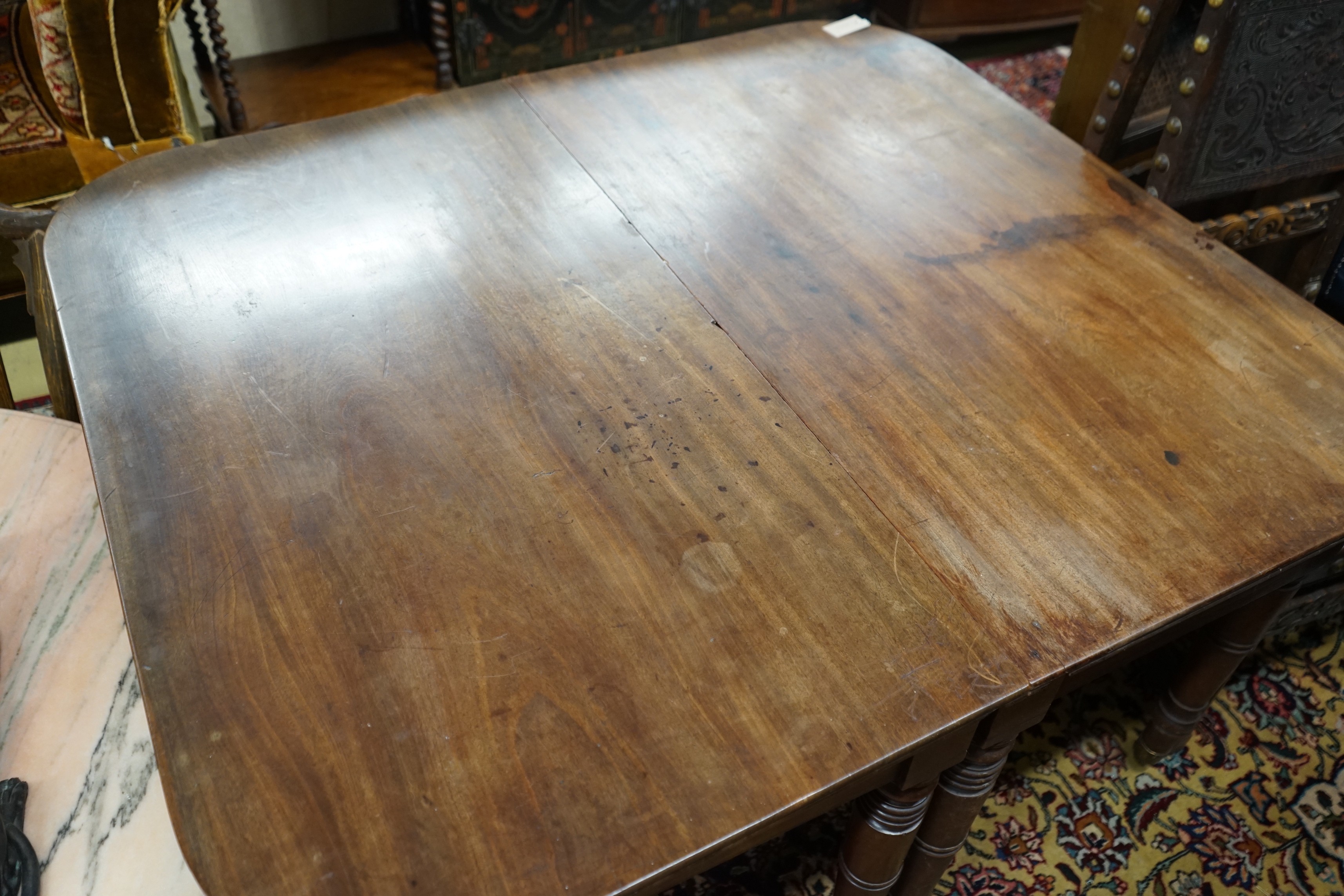 A pair of Regency mahogany table D end sections, length 128cm, depth 112cm, height 72cm